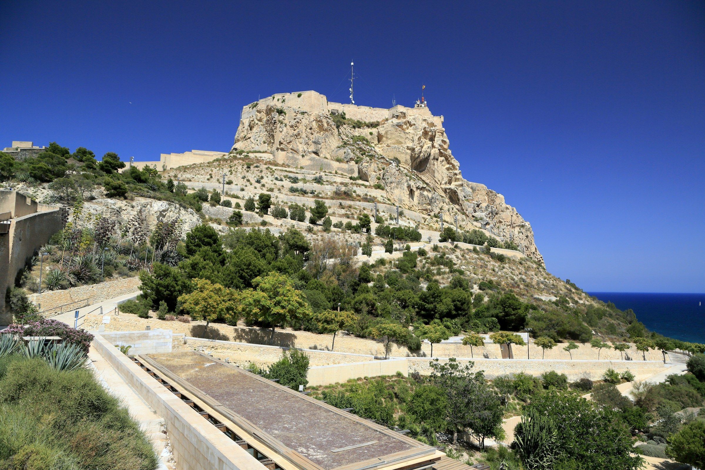 Castillo de Santa Bárbara atop Mount Benacantil in Alicante, with the Mediterranean Sea in the background